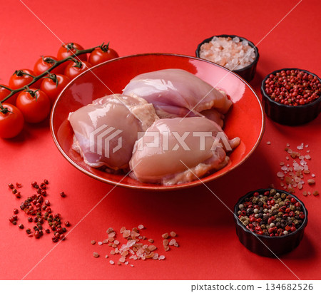 Chicken thigh fillet, skinless and boneless meat for grilling or barbecue. Chicken thigh fillet Chicken thigh fillet, skinless and boneless meat for grilling or barbecue. Chicken thigh fillet 134682526