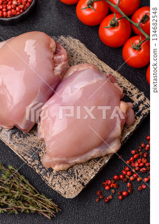 Chicken thigh fillet, skinless and boneless meat for grilling or barbecue. Chicken thigh fillet Chicken thigh fillet, skinless and boneless meat for grilling or barbecue. Chicken thigh fillet 134682548