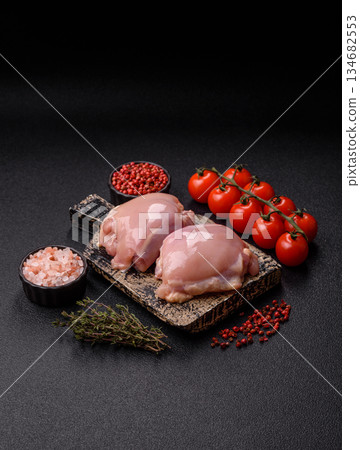 Chicken thigh fillet, skinless and boneless meat for grilling or barbecue. Chicken thigh fillet Chicken thigh fillet, skinless and boneless meat for grilling or barbecue. Chicken thigh fillet 134682553