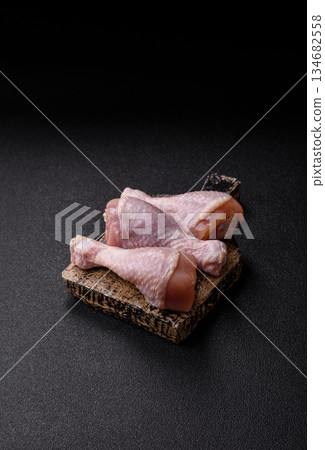 Raw chicken legs, poultry meat for grilling or barbecue. Chicken legs Raw chicken legs, poultry meat for grilling or barbecue. Chicken legs 134682558