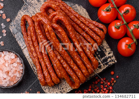 Smoked cabanossi, thin salami sausage, meat sticks, or snacks. Cabanossi sausage Smoked cabanossi, thin salami sausage, meat sticks, or snacks. Cabanossi sausage 134682711