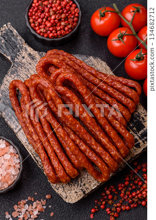 Smoked cabanossi, thin salami sausage, meat sticks, or snacks. Cabanossi sausage Smoked cabanossi, thin salami sausage, meat sticks, or snacks. Cabanossi sausage 134682712