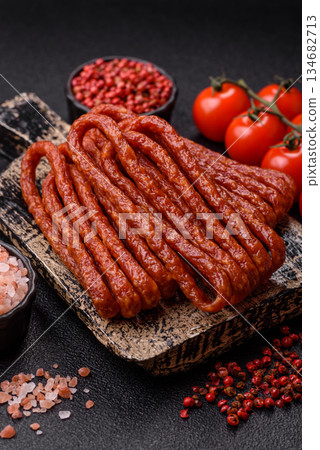 Smoked cabanossi, thin salami sausage, meat sticks, or snacks. Cabanossi sausage Smoked cabanossi, thin salami sausage, meat sticks, or snacks. Cabanossi sausage 134682713