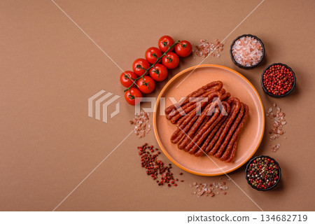 Smoked cabanossi, thin salami sausage, meat sticks, or snacks. Cabanossi sausage Smoked cabanossi, thin salami sausage, meat sticks, or snacks. Cabanossi sausage 134682719