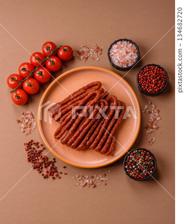 Smoked cabanossi, thin salami sausage, meat sticks, or snacks. Cabanossi sausage Smoked cabanossi, thin salami sausage, meat sticks, or snacks. Cabanossi sausage 134682720