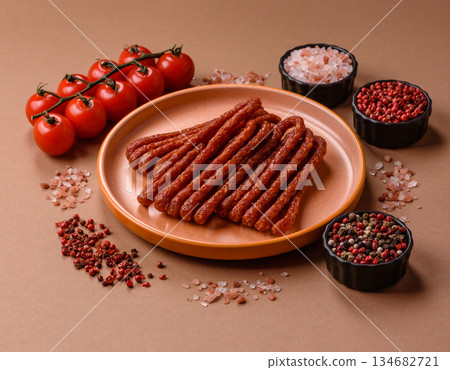 Smoked cabanossi, thin salami sausage, meat sticks, or snacks. Cabanossi sausage 134682721