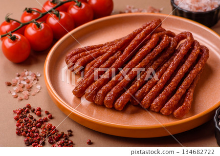 Smoked cabanossi, thin salami sausage, meat sticks, or snacks. Cabanossi sausage 134682722
