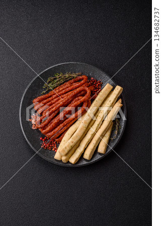 Grissini breadsticks, an Italian wheat pastry, are a great lunch snack. Grissini breadsticks Grissini breadsticks, an Italian wheat pastry, are a great lunch snack. Grissini breadsticks 134682737