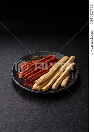 Grissini breadsticks, an Italian wheat pastry, are a great lunch snack. Grissini breadsticks Grissini breadsticks, an Italian wheat pastry, are a great lunch snack. Grissini breadsticks 134682738