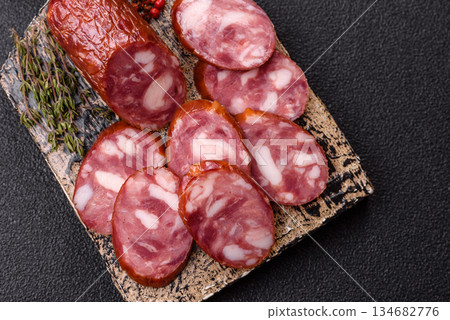 Smoked salami, thin beef or pork sausage, meat snacks. Salami sausage Smoked salami, thin beef or pork sausage, meat snacks. Salami sausage 134682776