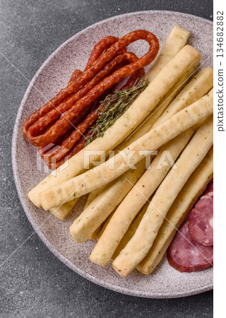 Grissini breadsticks, an Italian wheat pastry, are a great lunch snack. Grissini breadsticks Grissini breadsticks, an Italian wheat pastry, are a great lunch snack. Grissini breadsticks 134682882