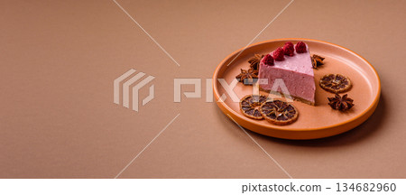 Raspberry or strawberry cheesecake, a slice of sweet red cake with berries. Raspberry cheesecake Raspberry or strawberry cheesecake, a slice of sweet red cake with berries. Raspberry cheesecake 134682960