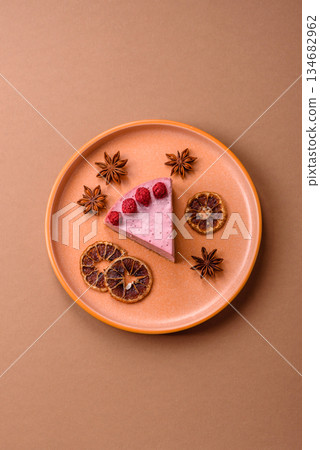 Raspberry or strawberry cheesecake, a slice of sweet red cake with berries. Raspberry cheesecake Raspberry or strawberry cheesecake, a slice of sweet red cake with berries. Raspberry cheesecake 134682962