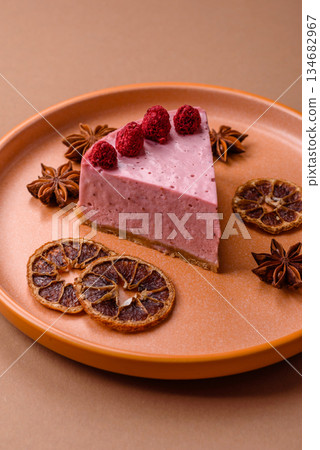 Raspberry or strawberry cheesecake, a slice of sweet red cake with berries. Raspberry cheesecake 134682967