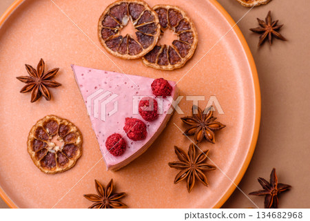 Raspberry or strawberry cheesecake, a slice of sweet red cake with berries. Raspberry cheesecake Raspberry or strawberry cheesecake, a slice of sweet red cake with berries. Raspberry cheesecake 134682968