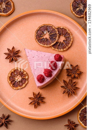 Raspberry or strawberry cheesecake, a slice of sweet red cake with berries. Raspberry cheesecake Raspberry or strawberry cheesecake, a slice of sweet red cake with berries. Raspberry cheesecake 134682969