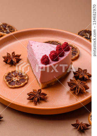 Raspberry or strawberry cheesecake, a slice of sweet red cake with berries. Raspberry cheesecake Raspberry or strawberry cheesecake, a slice of sweet red cake with berries. Raspberry cheesecake 134682970