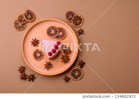 Raspberry or strawberry cheesecake, a slice of sweet red cake with berries. Raspberry cheesecake Raspberry or strawberry cheesecake, a slice of sweet red cake with berries. Raspberry cheesecake 134682972