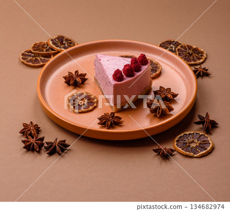 Raspberry or strawberry cheesecake, a slice of sweet red cake with berries. Raspberry cheesecake Raspberry or strawberry cheesecake, a slice of sweet red cake with berries. Raspberry cheesecake 134682974
