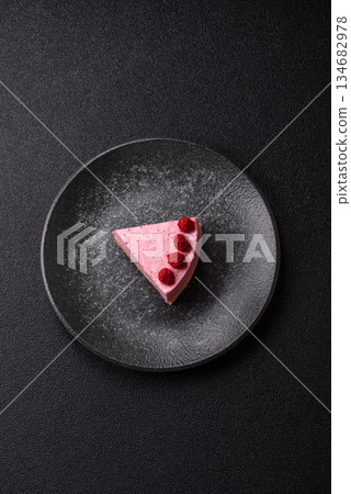 Raspberry or strawberry cheesecake, a slice of sweet red cake with berries. Raspberry cheesecake 134682978