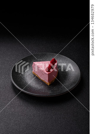Raspberry or strawberry cheesecake, a slice of sweet red cake with berries. Raspberry cheesecake 134682979
