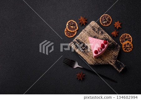 Raspberry or strawberry cheesecake, a slice of sweet red cake with berries. Raspberry cheesecake 134682994