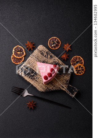 Raspberry or strawberry cheesecake, a slice of sweet red cake with berries. Raspberry cheesecake Raspberry or strawberry cheesecake, a slice of sweet red cake with berries. Raspberry cheesecake 134682995