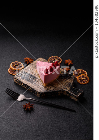 Raspberry or strawberry cheesecake, a slice of sweet red cake with berries. Raspberry cheesecake 134682996