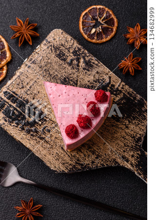 Raspberry or strawberry cheesecake, a slice of sweet red cake with berries. Raspberry cheesecake Raspberry or strawberry cheesecake, a slice of sweet red cake with berries. Raspberry cheesecake 134682999