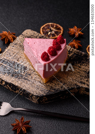 Raspberry or strawberry cheesecake, a slice of sweet red cake with berries. Raspberry cheesecake Raspberry or strawberry cheesecake, a slice of sweet red cake with berries. Raspberry cheesecake 134683000