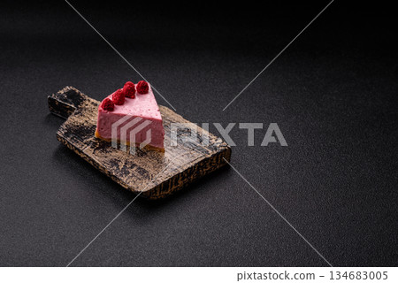 Raspberry or strawberry cheesecake, a slice of sweet red cake with berries. Raspberry cheesecake 134683005