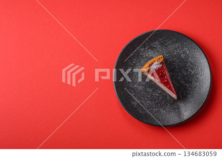 Strawberry cheesecake, a slice of sweet pie, a classic cheesecake dessert. Strawberry cheesecake Strawberry cheesecake, a slice of sweet pie, a classic cheesecake dessert. Strawberry cheesecake 134683059