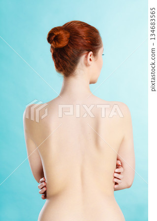 Young woman with naked back 134683565
