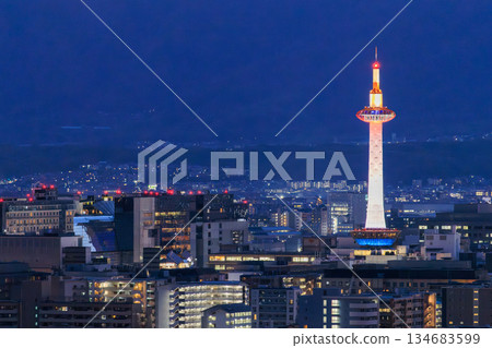 Evening view of Kyoto: Kyoto Station and Kyoto Tower lit up Evening view of Kyoto: Kyoto Station and Kyoto Tower lit up 134683599