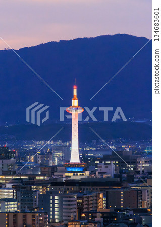 Evening view of Kyoto: Kyoto Station and Kyoto Tower lit up Evening view of Kyoto: Kyoto Station and Kyoto Tower lit up 134683601