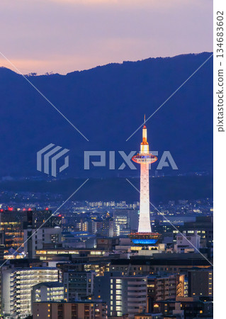 Evening view of Kyoto: Kyoto Station and Kyoto Tower lit up Evening view of Kyoto: Kyoto Station and Kyoto Tower lit up 134683602