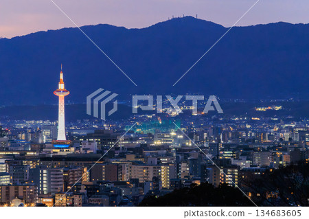 Evening view of Kyoto: Kyoto Station and Kyoto Tower lit up Evening view of Kyoto: Kyoto Station and Kyoto Tower lit up 134683605