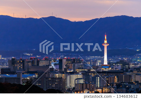 Evening view of Kyoto: Kyoto Station and Kyoto Tower lit up Evening view of Kyoto: Kyoto Station and Kyoto Tower lit up 134683612
