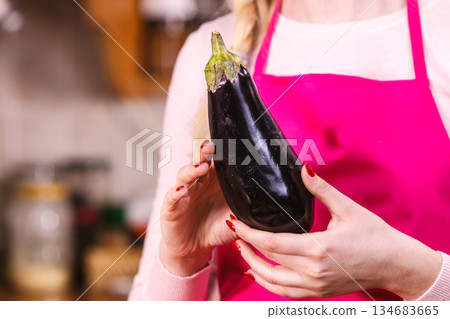 Woman holding eggplant 134683665