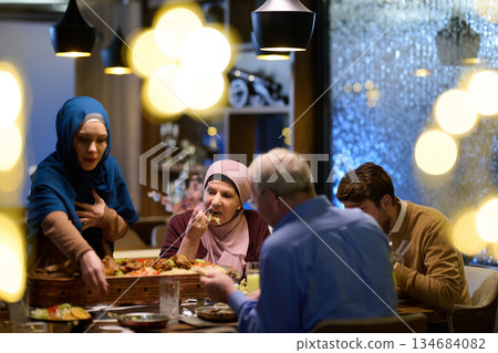 Muslim family breaks their fast together in a decorated restaurant during Ramadan 134684082