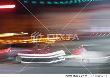 A car driving through the night, leaving a trail of light A car driving through the night, leaving a trail of light 134684734