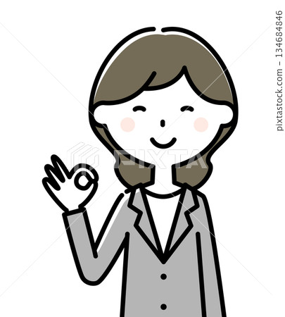 Woman in suit putting out ok sign 134684846