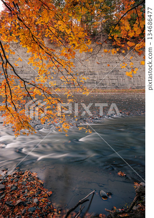 Autumn River with Long Exposure and Shale Cliff 134686477