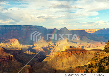 Grand Canyon Vista with Rainbow and Golden Sunlight Grand Canyon Vista with Rainbow and Golden Sunlight 134686579