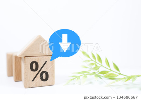Building block house and percent symbol showing falling interest rates. Mortgage loan concept. 134686667