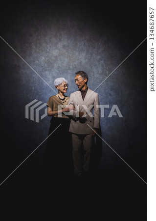 Smiling senior couple with arms crossed 134687657