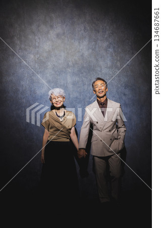 Smiling senior couple with arms crossed 134687661