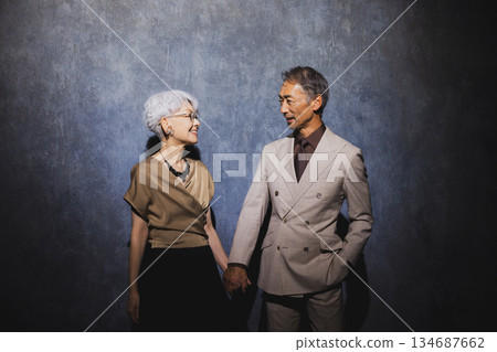 Smiling senior couple with arms crossed 134687662