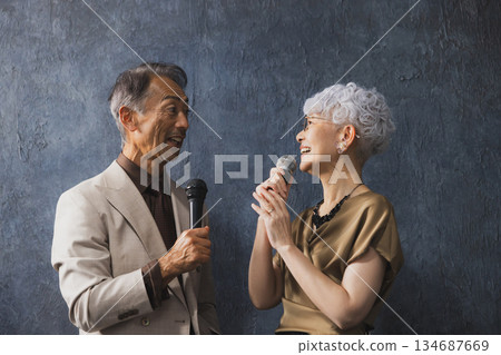Smiling senior couple with arms crossed 134687669