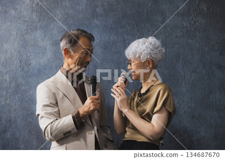 Smiling senior couple with arms crossed 134687670